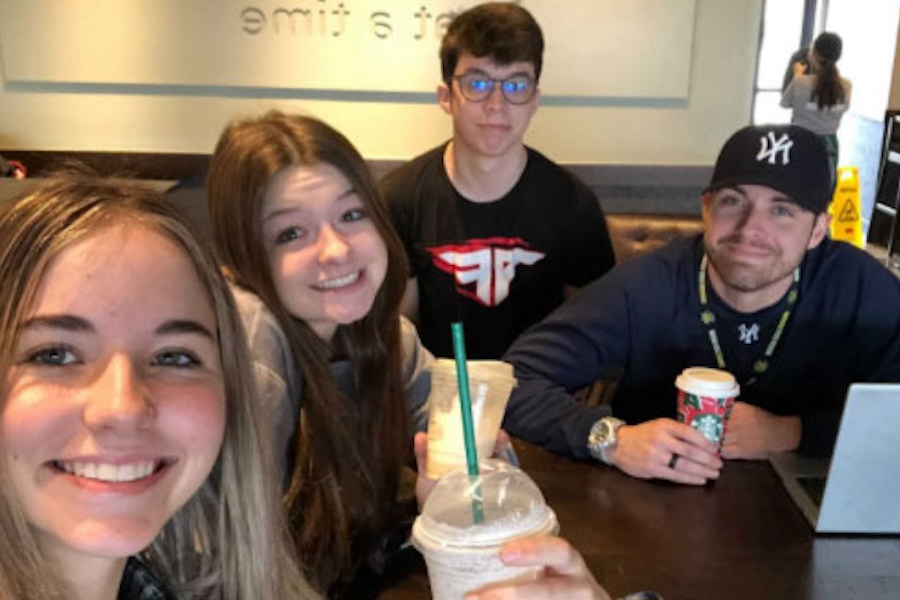 5Tips 3 students and their adviser take a selfie at a Starbucks