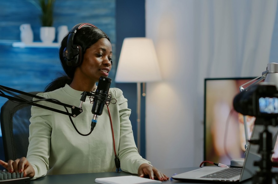 Photo of a girl recording a podcast