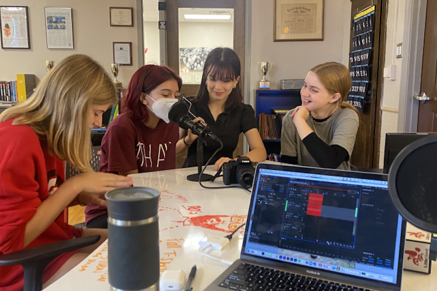 Photo of 4 girls recording a podcast