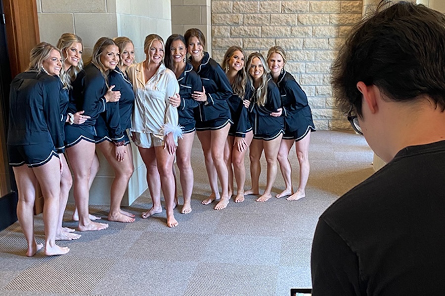 Photo of a person taking a photo of a bridal party