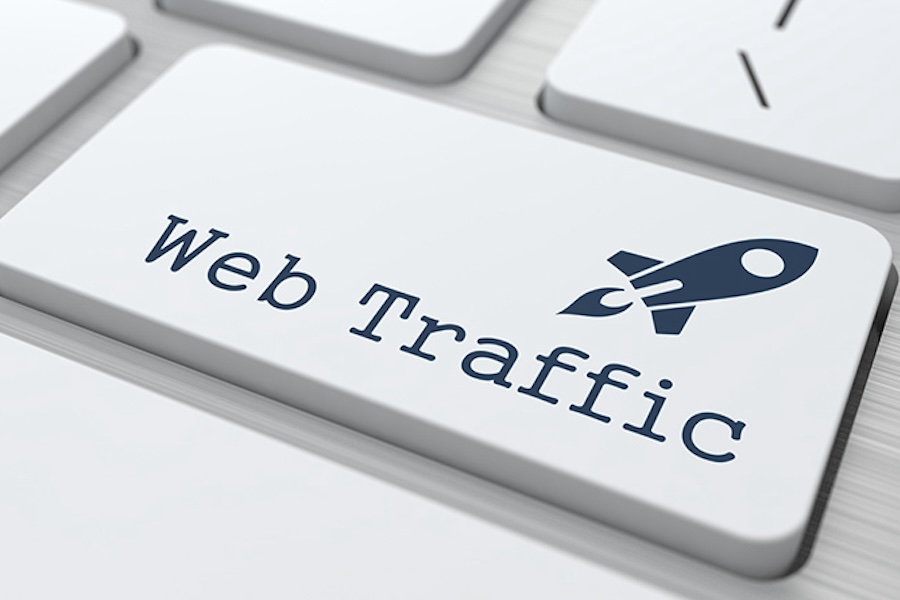 A computer button that says Web Traffic with a rocketship icon