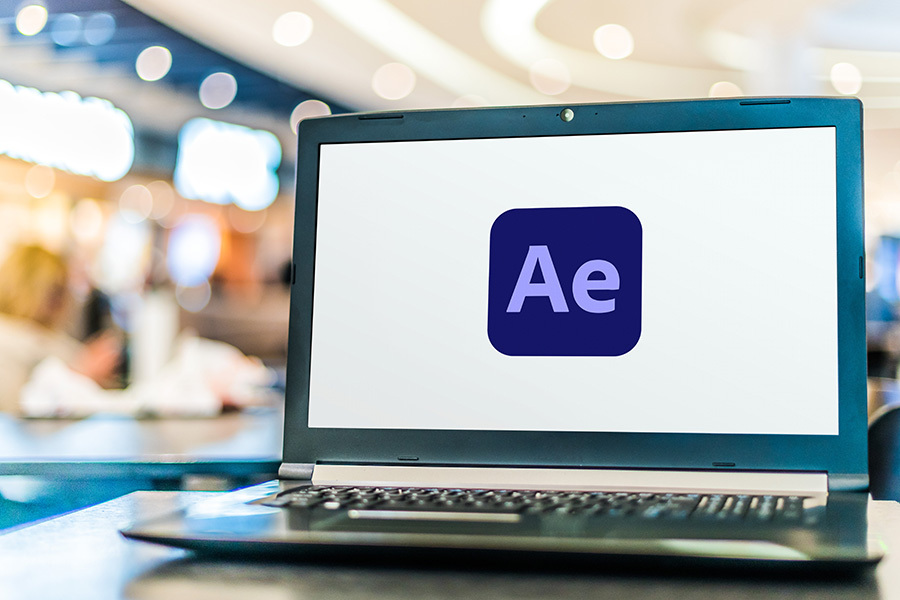 Computer open with the Adobe After Effects Logo in frame