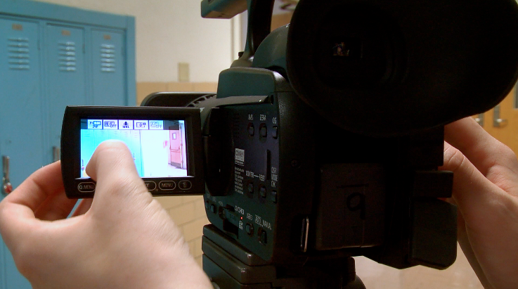 Photo of a person using a camera