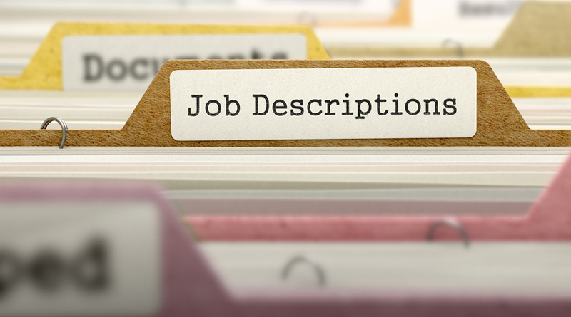 Photo of files and one is labeled Job Descriptions