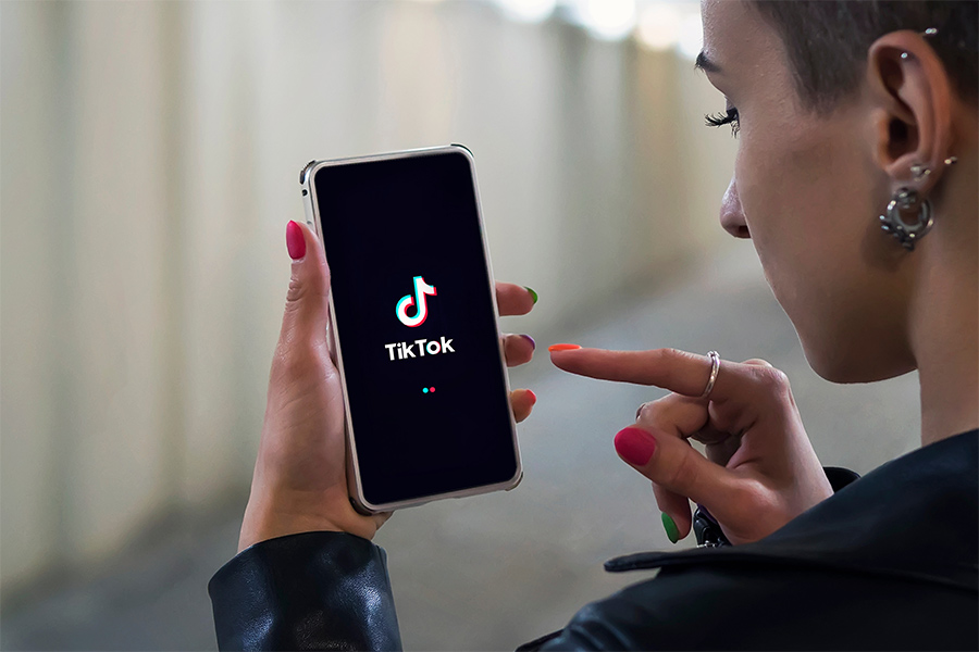 Photo of someone using Tik Tok on a phone