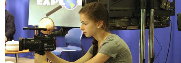 Photo of a girl using a camera