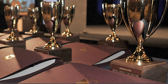 Close up photo of trophies and certificates