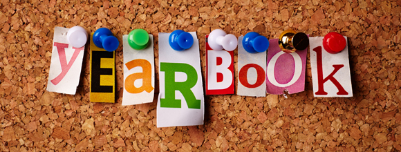 Graphic of tacs holding up words that spell yearbook on a corkboard