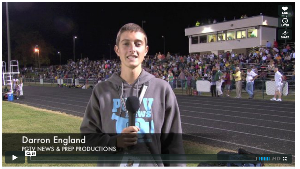 Photo of a student reporting live from a football game, the video is titled Darron England, PGTV News and Prep Productions