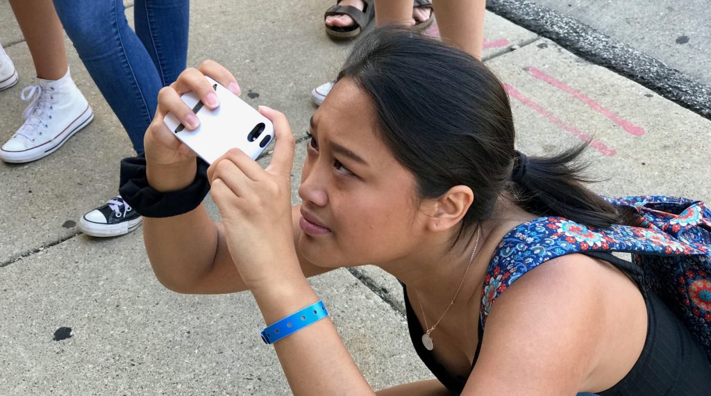 Photo of a student taking an upward photo