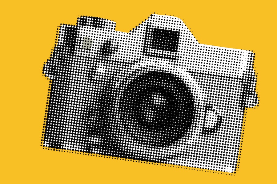 Photo of a camera which is pixelated with a yellow background