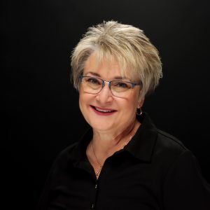 lori oglesbee smiling headshot