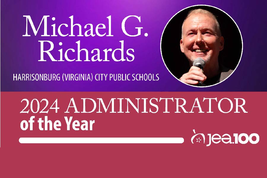 The top half of the graphic has a purple background with a large circular headshot of Michael G. Richards. Beneath this is text that reads, "Harrisonburg (Virginia) City Public Schools." The bottom half of the graphic is maroon with the JEA logo and text that reads, "2024 Administrator of the year"