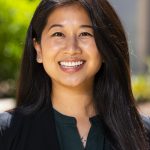 whitney huang headshot with a blurred background