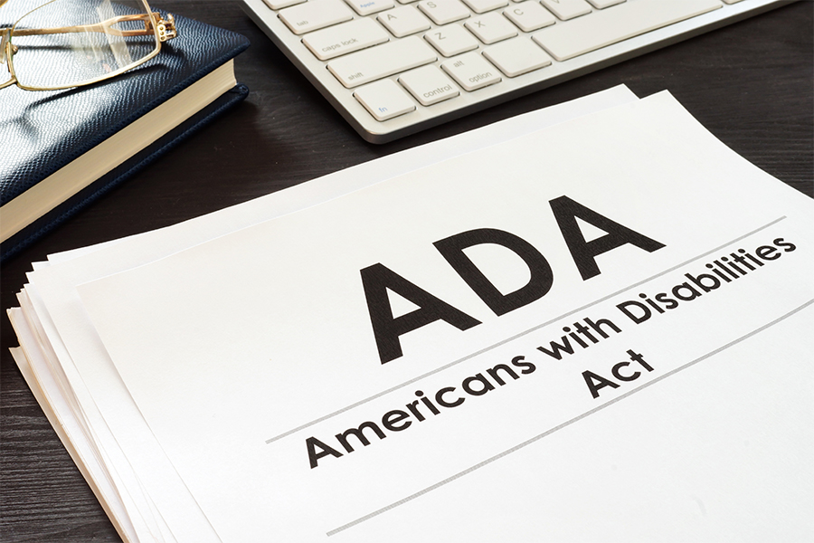 This is a decorative images of a paper sitting on the design with the letters ADA on it.